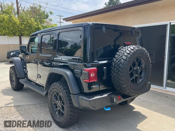 2023 Jeep Wrangler Sahara with VIN 1C4JJXP65PW627241, listed as a Copart auction lot 55661585 with 9,282 mi miles and Clean Title. Bid and sale history available at DreamBid. Image 3.