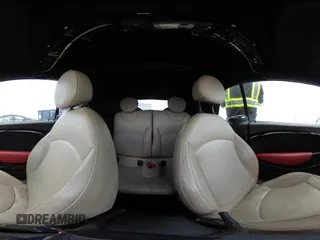 2014 MINI Convertible S z VIN WMWZP3C56ET707702, wystawiony jako IAAI lot #42431046 z przebiegiem 65 726 mil mil oraz . Historia ofert i sprzedaży dostępna na DreamBid. Obrazek 18.