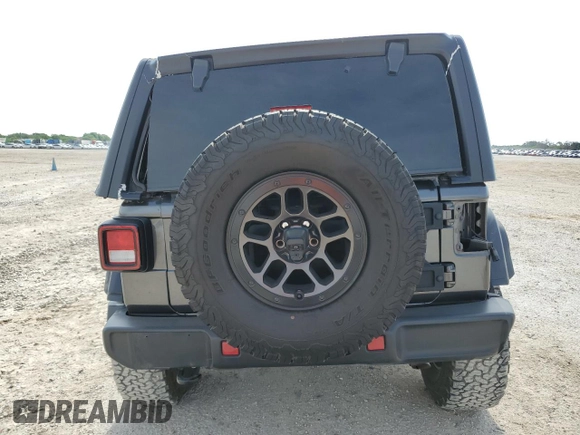 2023 Jeep Wrangler Willys with VIN 1C4HJXDGXPW526093, listed as a Copart auction lot 56818935 with 24,021 mi miles and Salvage title. Bid and sale history available at DreamBid. Image 6.
