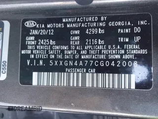2012 Kia Optima EX with VIN 5XXGN4A77CG042008, listed as a IAAI auction lot 41406766 with 76,644 mi miles. Bid and sale history available at carsss.com. Image 9.