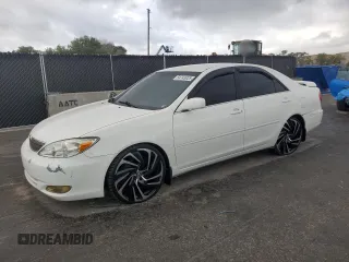 2002 Toyota Camry XLE z VIN 4T1BF32K42U012702, wystawiony jako Copart lot #54743925 z przebiegiem 328 776 mil mil oraz Szkoda całkowita • Salvage title. Historia ofert i sprzedaży dostępna na DreamBid. Obrazek 1.