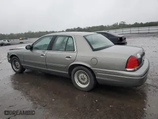 2001 Ford Crown Victoria LX with VIN 2FAFP74W71X139760, listed as a Copart auction lot 73740434 with 106,938 mi miles and Salvage Title. Bid and sale history available at carsss.com. Image 2.