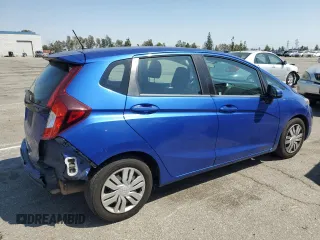 2015 Honda Fit LX with VIN 3HGGK5H53FM718378, listed as a Copart auction lot 52035245 with 104,786 mi miles and Salvage Title. Bid and sale history available at carsss.com. Image 3.