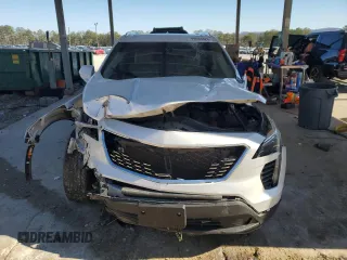 2021 Cadillac XT4 FWD Luxury с VIN 1GYAZAR47MF023407, выставлен на аукционе Copart как лот 88633325 с пробегом 77 353 миль миль и Списание • Salvage title. История ставок и продаж доступна на DreamBid. Изображение 5.