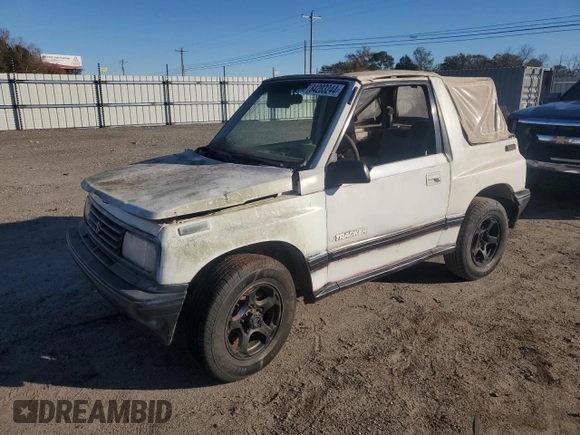 1990 Geo Tracker z VIN 2CNBJ18UXL6217744, wystawiony jako Copart lot #84203244 z przebiegiem 23 221 mil mil oraz Szkody całkowita. Historia ofert i sprzedaży dostępna na DreamBid. Obrazek 1.