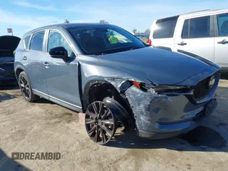 2021 Mazda CX-5 Touring with VIN JM3KFBCM9M0434433, listed as a IAAI auction lot 41425112 with 57,527 mi miles. Bid and sale history available at carsss.com. Image 1.