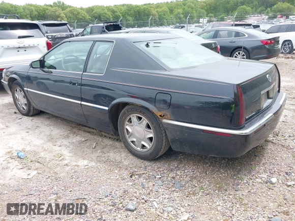 2002 Cadillac Eldorado ESC z VIN 1G6EL12Y82B105241, wystawiony jako IAAI lot #42241609 z przebiegiem 90 442 mil mil oraz . Historia ofert i sprzedaży dostępna na DreamBid. Obrazek 3.
