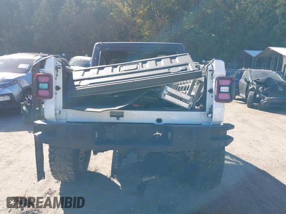 2020 Jeep Gladiator Sport S with VIN 1C6HJTAG3LL109494, listed as a IAAI auction lot 40677949 with 52,079 mi miles and . Bid and sale history available at DreamBid. Image 16.