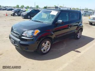 2011 Kia Soul + with VIN KNDJT2A27B7286270, listed as a IAAI auction lot 42063606 with 128,864 mi miles. Bid and sale history available at carsss.com. Image 2.