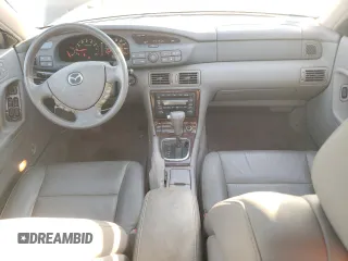 2002 Mazda Millenia z VIN JM1TA221021729625, wystawiony jako Copart lot #87304234 z przebiegiem 88 376 mil mil oraz Szkody całkowita. Historia ofert i sprzedaży dostępna na DreamBid. Obrazek 8.