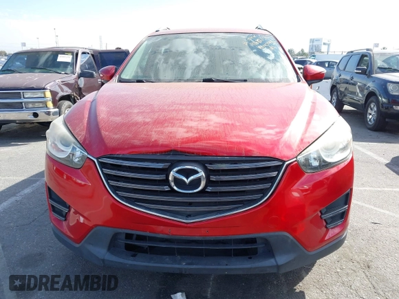 2016 Mazda CX-5 Sport with VIN JM3KE2BY4G0701442, listed as a IAAI auction lot 41682335 with 125,624 mi miles. Bid and sale history available at carsss.com. Image 13.
