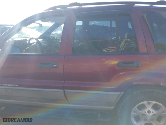 1999 Jeep Grand Cherokee Laredo with VIN 1J4GW58S5XC781472, listed as a IAAI auction lot 41738515 with 216,000 mi miles. Bid and sale history available at carsss.com. Image 14.