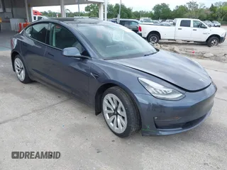 2021 Tesla Model 3 Long Range with VIN 5YJ3E1EB4MF855581, listed as a IAAI auction lot 41974515 with 71,561 mi miles. Bid and sale history available at carsss.com. Image 1.