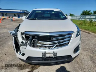 2017 Cadillac XT5 FWD z VIN 1GYKNARS2HZ173122, wystawiony jako Copart lot #63027715 z przebiegiem 130 467 mil mil oraz Czysty tytuł • Clean title. Historia ofert i sprzedaży dostępna na DreamBid. Obrazek 5.