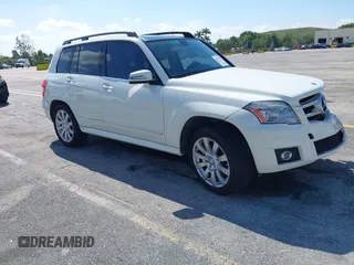 2012 Mercedes-Benz GLK with VIN WDCGG5GB8CF735979, listed as a IAAI auction lot 41931333 with 124,649 mi miles. Bid and sale history available at carsss.com. Image 1.