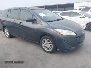 2012 Mazda 5 Sport with VIN JM1CW2BL6C0134921, listed as a IAAI auction lot 42290476 with 128,490 mi miles and . Bid and sale history available at DreamBid. Image 1.