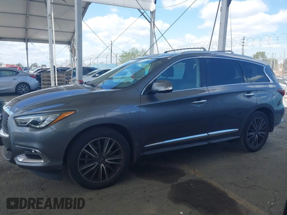 2019 Infiniti QX60 Pure z VIN 5N1DL0MN3KC565998, wystawiony jako IAAI lot #41911130 z przebiegiem 79 463 mil mil oraz . Historia ofert i sprzedaży dostępna na DreamBid. Obrazek 14.