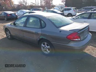 2004 Ford Taurus SE z VIN 1FAFP53U74A135287, wystawiony jako IAAI lot #40756396 z przebiegiem 141 483 mil mil oraz . Historia ofert i sprzedaży dostępna na DreamBid. Obrazek 3.