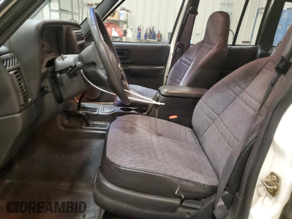 2000 Jeep Cherokee z VIN 1J4FF48S2YL104094, wystawiony jako Copart lot #57347705 z przebiegiem 75 948 mil mil oraz Nie do naprawy • Non repairable. Historia ofert i sprzedaży dostępna na DreamBid. Obrazek 7.