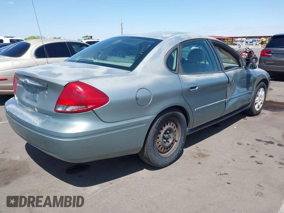 2005 Ford Taurus SE with VIN 1FAFP53U75A226240, listed as a IAAI auction lot 42066974 with 190,043 mi miles. Bid and sale history available at carsss.com. Image 4.