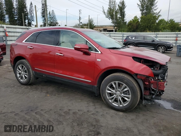 2021 Cadillac XT5 FWD Premium Luxury with VIN 1GYKNCRS7MZ149310, listed as a Copart auction lot 87937445 with 13,829 mi miles and Salvage Title. Bid and sale history available at DreamBid. Image 4.