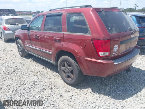 2007 Jeep Grand Cherokee Laredo with VIN 1J8GR48K57C618529, listed as a IAAI auction lot 42139566 with 174,559 mi miles. Bid and sale history available at carsss.com. Image 3.
