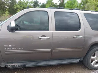 2011 Chevrolet Suburban LT with VIN 1GNSCJE03BR267184, listed as a IAAI auction lot 42156424 with 307,618 mi miles. Bid and sale history available at carsss.com. Image 14.