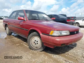 1990 Toyota Camry z VIN 4T1SV22E4LU267956, wystawiony jako IAAI lot #42514219 z przebiegiem 247 355 mil mil oraz . Historia ofert i sprzedaży dostępna na DreamBid. Obrazek 1.