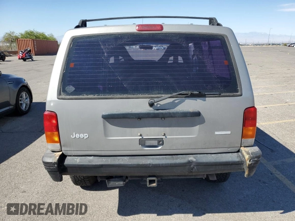 2000 Jeep Cherokee SE with VIN 1J4FF27SXYL140055, listed as a Copart auction lot 70315454 with 176,017 mi miles and Salvage title. Bid and sale history available at DreamBid. Image 6.