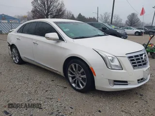 2015 Cadillac XTS Luxury z VIN 2G61M5S33F9121460, wystawiony jako IAAI lot #41091910 z przebiegiem 128 041 mil mil oraz . Historia ofert i sprzedaży dostępna na DreamBid. Obrazek 1.