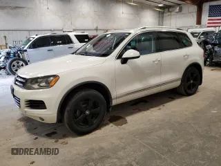 2012 Volkswagen Touareg Sport z VIN WVGFK9BP3CD002756, wystawiony jako Copart lot #53378665 z przebiegiem 149 918 mil mil oraz Czysty tytuł • Clean title. Historia ofert i sprzedaży dostępna na DreamBid. Obrazek 1.