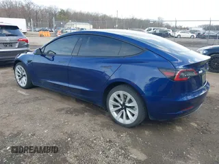 2022 Tesla Model 3 with VIN 5YJ3E1EA7NF188417, listed as a IAAI auction lot 41885623 with 105,457 mi miles and . Bid and sale history available at DreamBid. Image 3.