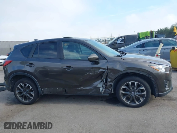 2016 Mazda CX-5 Grand Touring z VIN JM3KE4DY2G0684066, wystawiony jako IAAI lot #42078725 z przebiegiem 200 129 mil mil oraz . Historia ofert i sprzedaży dostępna na DreamBid. Obrazek 13.
