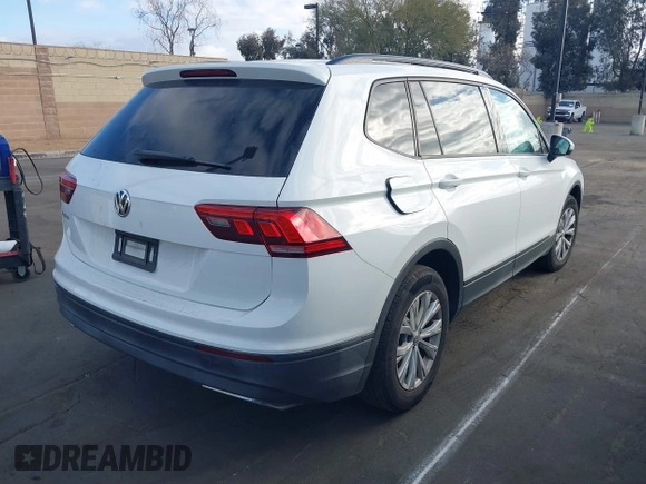 2019 Volkswagen Tiguan S with VIN 3VV1B7AX2KM039970, listed as a IAAI auction lot 41498706 with 56,907 mi miles and . Bid and sale history available at DreamBid. Image 4.