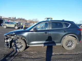 2021 Mazda CX-5 Touring with VIN JM3KFBCM2M1303063, listed as a IAAI auction lot 41814604 with 36,116 mi miles. Bid and sale history available at carsss.com. Image 14.