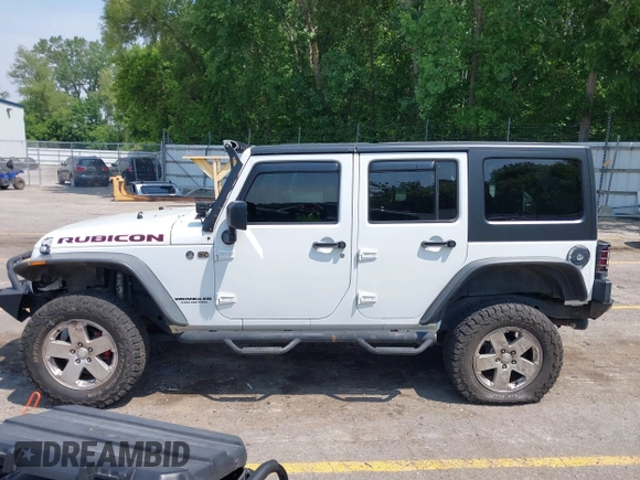 2015 Jeep Wrangler Unlimited Rubicon z VIN 1C4BJWFGXFL755810, wystawiony jako IAAI lot #42495531 z przebiegiem 109 668 mil mil oraz . Historia ofert i sprzedaży dostępna na DreamBid. Obrazek 14.