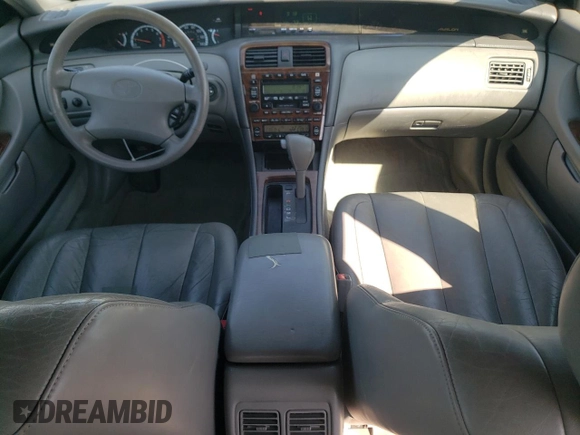 2000 Toyota Avalon XL with VIN 4T1BF28B7YU112576, listed as a Copart auction lot 59726505 with 242,412 mi miles and Salvage title. Bid and sale history available at DreamBid. Image 8.
