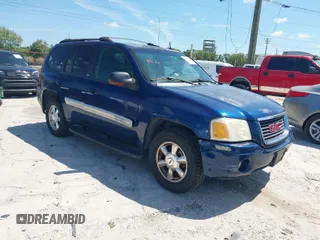 2004 GMC Envoy SLE with VIN 1GKDT13S142206535, listed as a IAAI auction lot 41853542 with 135,053 mi miles. Bid and sale history available at carsss.com. Image 1.
