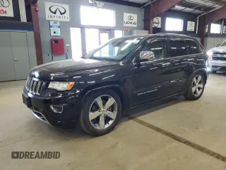 2015 Jeep Grand Cherokee Overland z VIN 1C4RJFCT4FC632858, wystawiony jako Copart lot #57150115 z przebiegiem 306 322 mil mil oraz Czysty tytuł • Clean title. Historia ofert i sprzedaży dostępna na DreamBid. Obrazek 1.