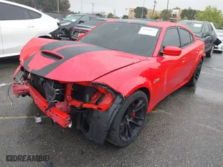 2022 Dodge Charger Scat Pack with VIN 2C3CDXGJ7NH229307, listed as a IAAI auction lot 41808821 with 12,184 mi miles. Bid and sale history available at carsss.com. Image 2.