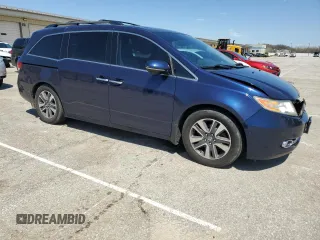 2014 Honda Odyssey Touring with VIN 5FNRL5H96EB068651, listed as a Copart auction lot 51649735 with 157,213 mi miles and Salvage title. Bid and sale history available at DreamBid. Image 4.