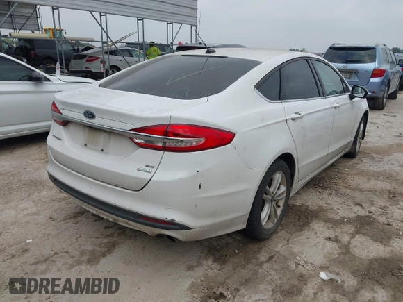 2018 Ford Fusion SE z VIN 3FA6P0HD1JR191576, wystawiony jako IAAI lot #42282669 z przebiegiem 73 439 mil mil oraz . Historia ofert i sprzedaży dostępna na DreamBid. Obrazek 4.