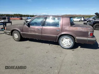 1989 Dodge Dynasty z VIN 1B3BC4637KD532206, wystawiony jako Copart lot #74233744 z przebiegiem 85 245 mil mil oraz Czysty tytuł • Clean title. Historia ofert i sprzedaży dostępna na DreamBid. Obrazek 2.