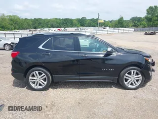 2021 Chevrolet Equinox Premier with VIN 2GNAXNEV5M6151910, listed as a IAAI auction lot 42110010 with 45,911 mi miles and . Bid and sale history available at DreamBid. Image 14.