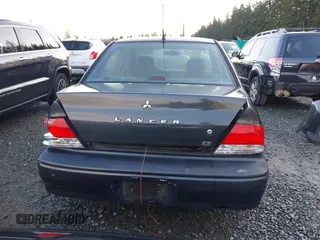 2003 Mitsubishi Lancer ES with VIN JA3AJ26E83U006060, listed as a IAAI auction lot 41254660 with 220,490 mi miles. Bid and sale history available at carsss.com. Image 16.
