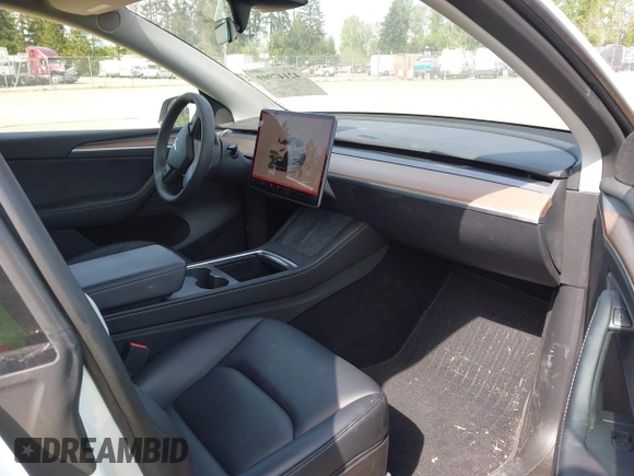 2023 Tesla Model Y Long Range with VIN 7SAYGDEE4PF676167, listed as a IAAI auction lot 42147909 with 20,488 mi miles. Bid and sale history available at carsss.com. Image 5.