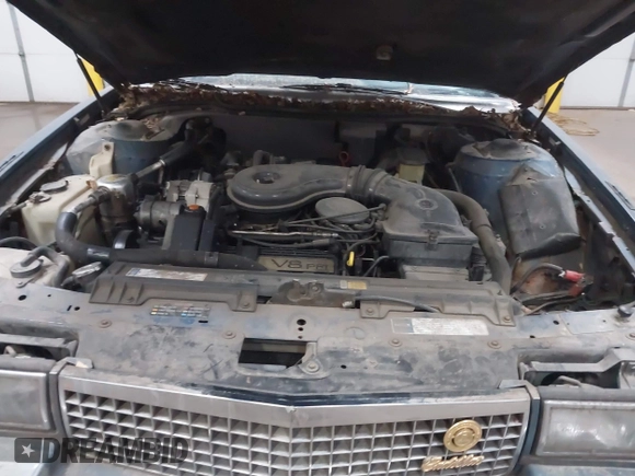 1990 Cadillac DeVille z VIN 1G6CD5331L4293427, wystawiony jako IAAI lot #41764635 z przebiegiem 198 499 mil mil oraz . Historia ofert i sprzedaży dostępna na DreamBid. Obrazek 10.