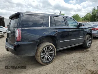 2019 GMC Yukon Denali with VIN 1GKS1CKJ0KR259491, listed as a Copart auction lot 51071335 with 105,294 mi miles and Salvage Title. Bid and sale history available at carsss.com. Image 3.