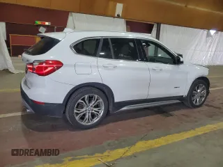 2017 BMW X1 xDrive28i with VIN WBXHT3Z34H4A54811, listed as a Copart auction lot 63584405 with 92,699 mi miles and Salvage title. Bid and sale history available at DreamBid. Image 3.