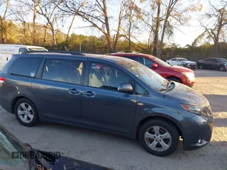 2011 Toyota Sienna LE AAS with VIN 5TDKK3DC2BS070656, listed as a IAAI auction lot 41034261 with 259,239 mi miles. Bid and sale history available at carsss.com. Image 13.